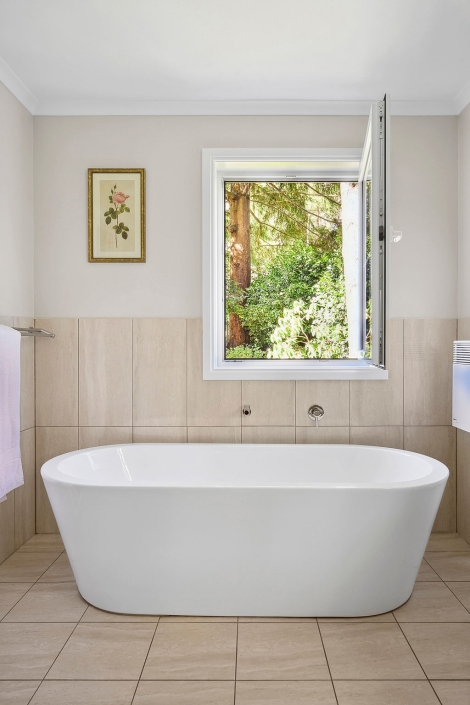 Bathroom with UPVC tilt and turn window offering natural light