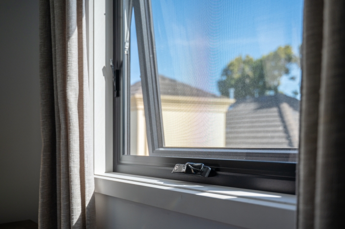 Close-up of UPVC Window Screen UPVC window screen and latch mechanism