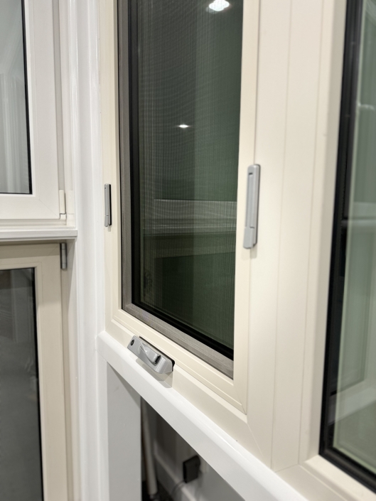 High-Quality UPVC Window Handle Close-up of high-quality UPVC window handle and latch