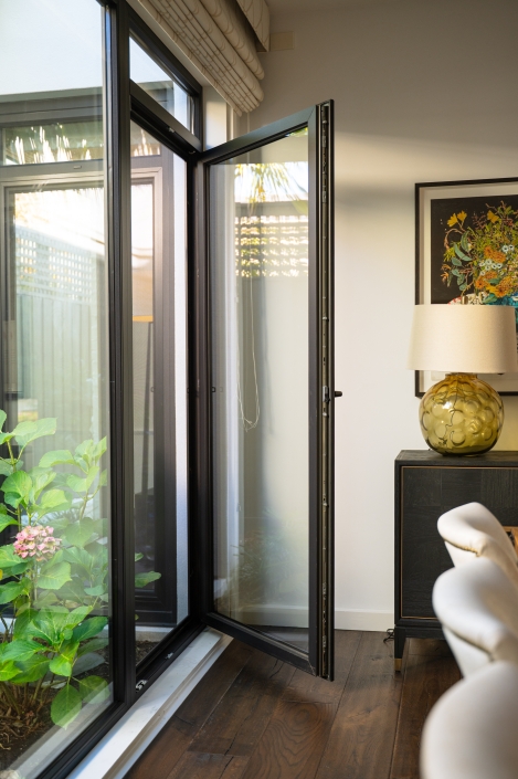 Living room with UPVC tilt and turn window offering an outdoor view