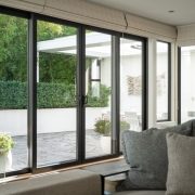 Large energy-efficient windows with a view of the backyard