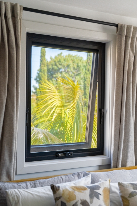 Modern UPVC Window with Outdoor View UPVC window with view of palm trees outside