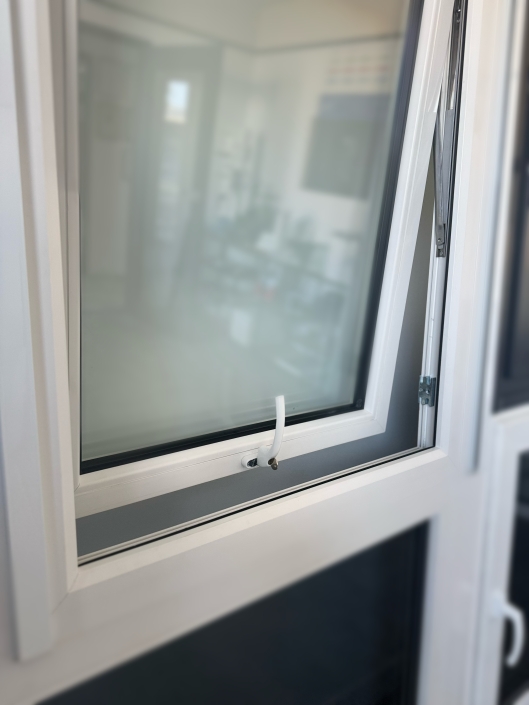 UPVC Window with Mesh Screen Close-up of energy-efficient UPVC window with mesh screen